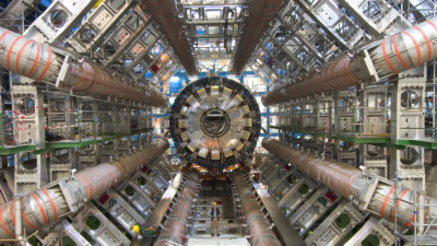 The eight toroid magnets can be seen surrounding the calorimeter that is later moved into the middle of the detector. This calorimeter will measure the energies of particles produced when protons collide in the centre of the detector.