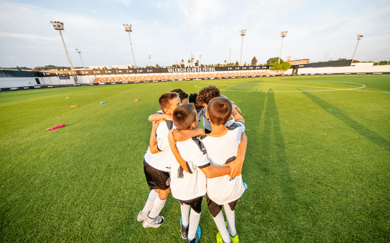 Team Celebrating on Pitch at Valencia CF